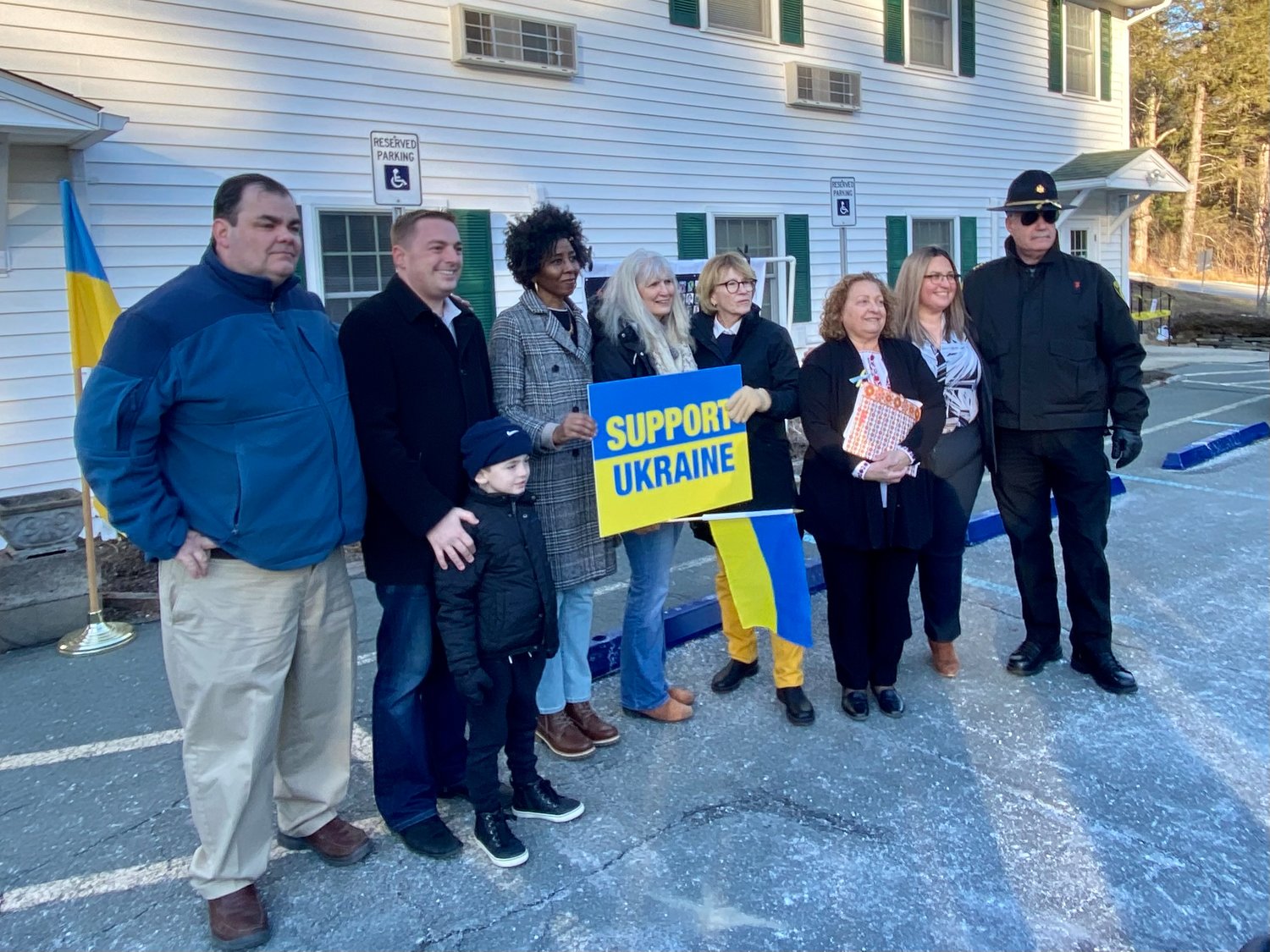 State and county officials— legisltive chair Rob Doherty, Senator Mike Martucci, human rights commissioner Adrienne Jensen, treasurer Nancy Buck, Assemblywoman Aileen Gunther, legislator Nadia Rajsz, district attorney Meagan Galligan, and sheriff Mike Shiff—stand in solidarity with the people of Ukraine.